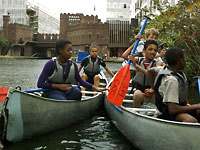 photo of a group canoeing at The Pirate Castle